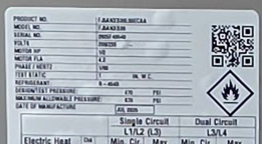 A close-up of the same rating plate: the product, model and serial number lines, then the date of manufacture