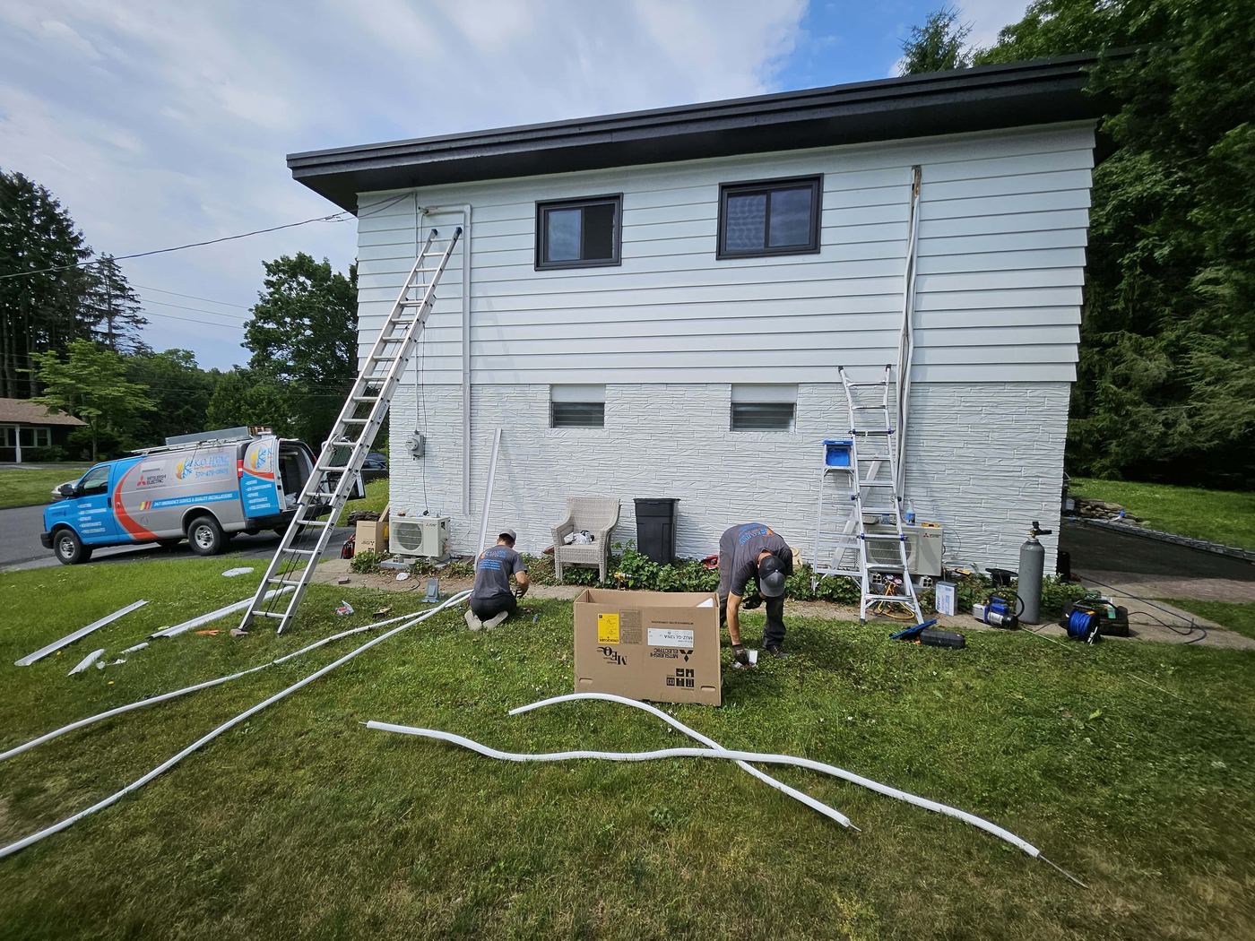 KO HVAC technicians installing Mitsubishi outdoor ductless systems at residential home in Kingston, PA.