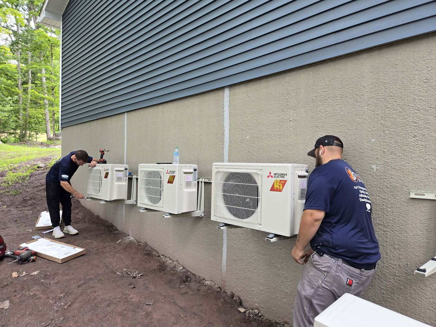 K.O. HVAC team installing a line of wall mounted Mitsubishi Electric high efficiency condensers.