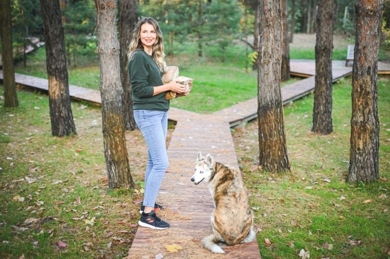 Mature adult woman carrying firewood