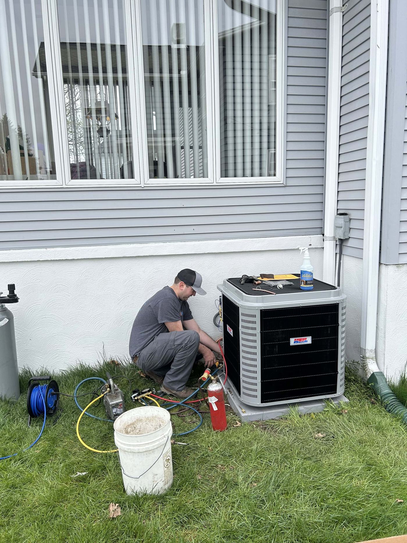 KO HVAC technician performing an AC installation in Wyoming, PA.