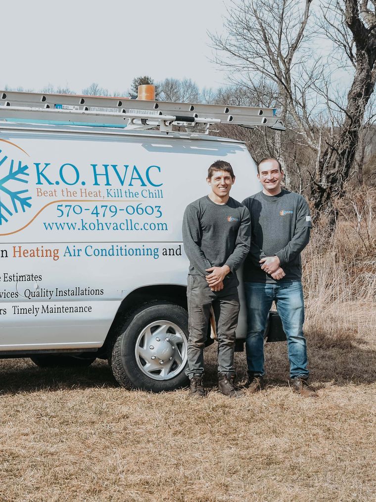 Stephen Klebetz and Cody Orr beside KO HVAC's first van