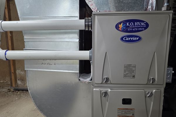 A Carrier furnace with a KO HVAC plate and new sheet-metal ductwork