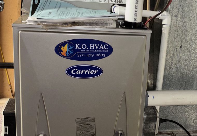 A new Carrier furnace with a KO HVAC sticker
