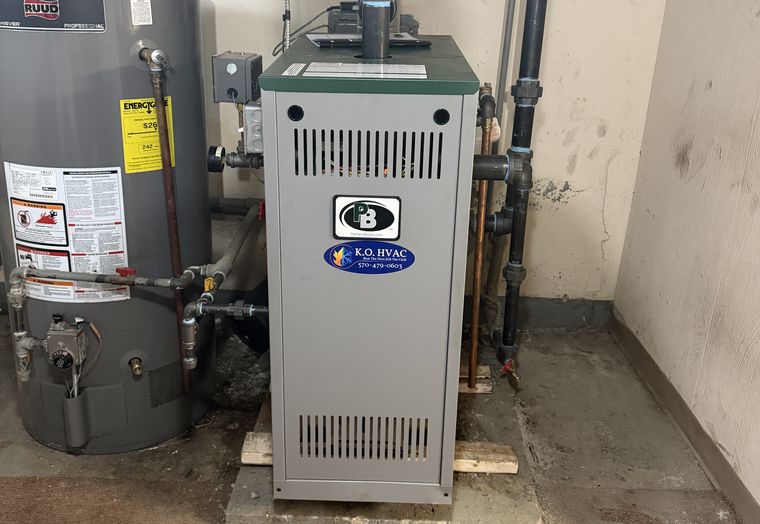 A boiler and a water heater in a basement
