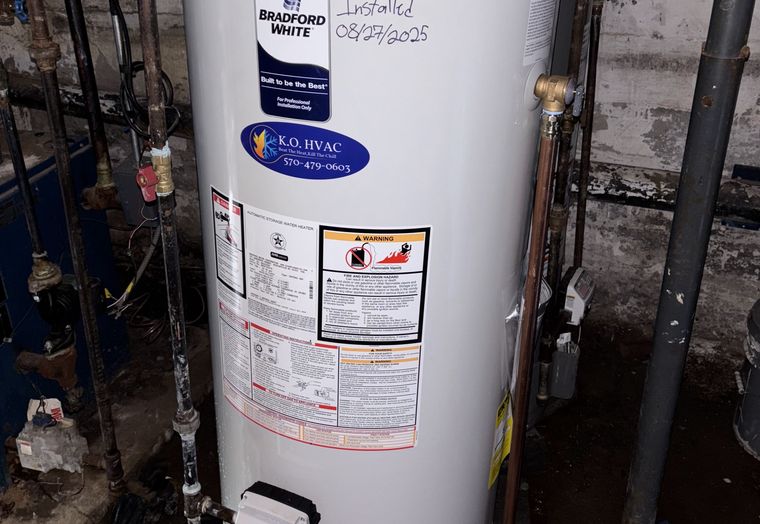 A Bradford White water heater with a KO HVAC sticker