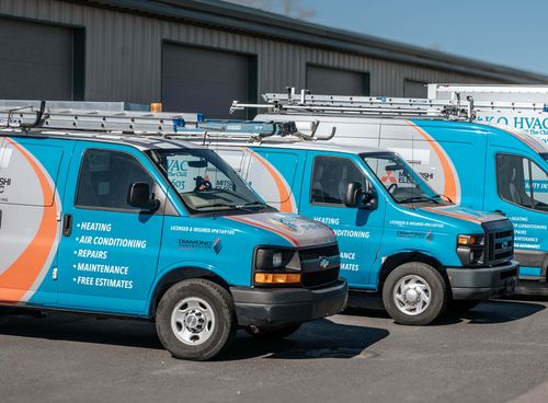 Wrapped KO HVAC vans outside the Page Avenue shop