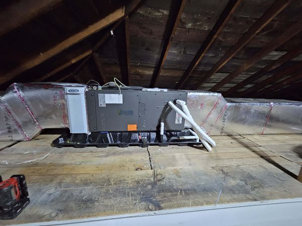 Attic air handler with new insulated ductwork runs